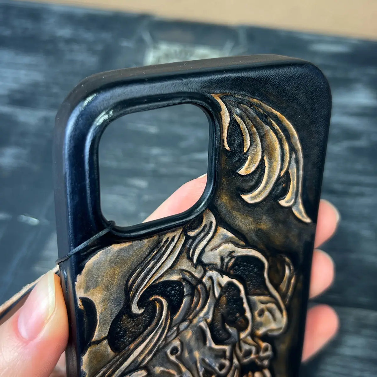 Hand-Carved Leather iPhone 15 Case: Embossed Skull Art