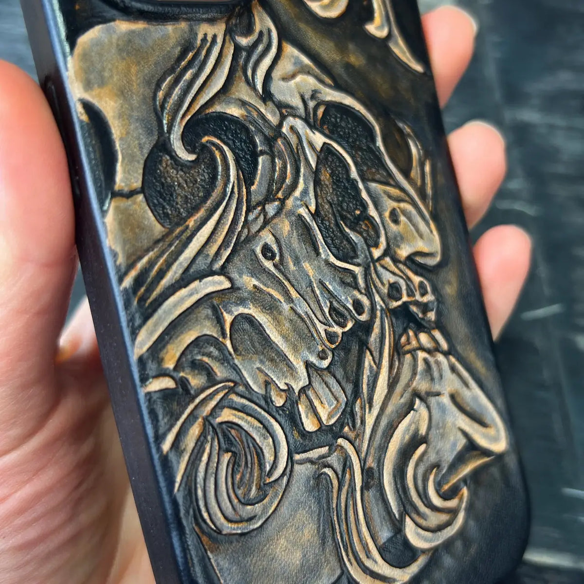 Hand-Carved Leather iPhone 15 Case: Embossed Skull Art