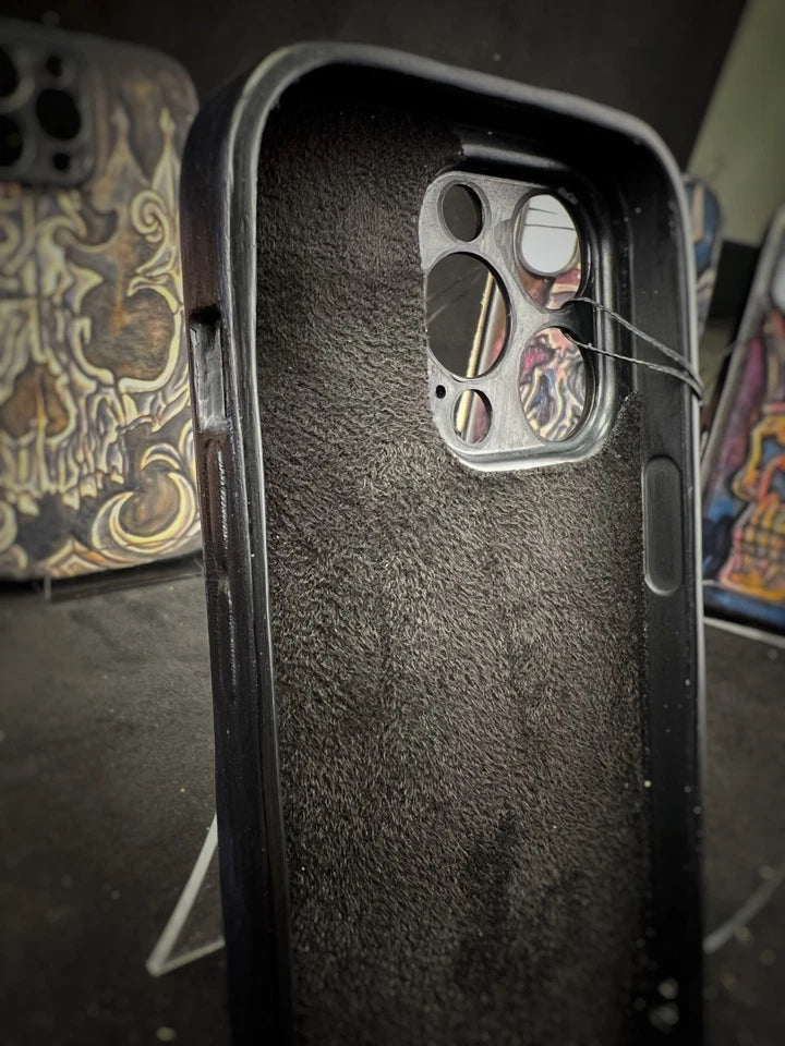 Hand-Carved Leather iPhone 14 Pro Case: Embossed Skull Art