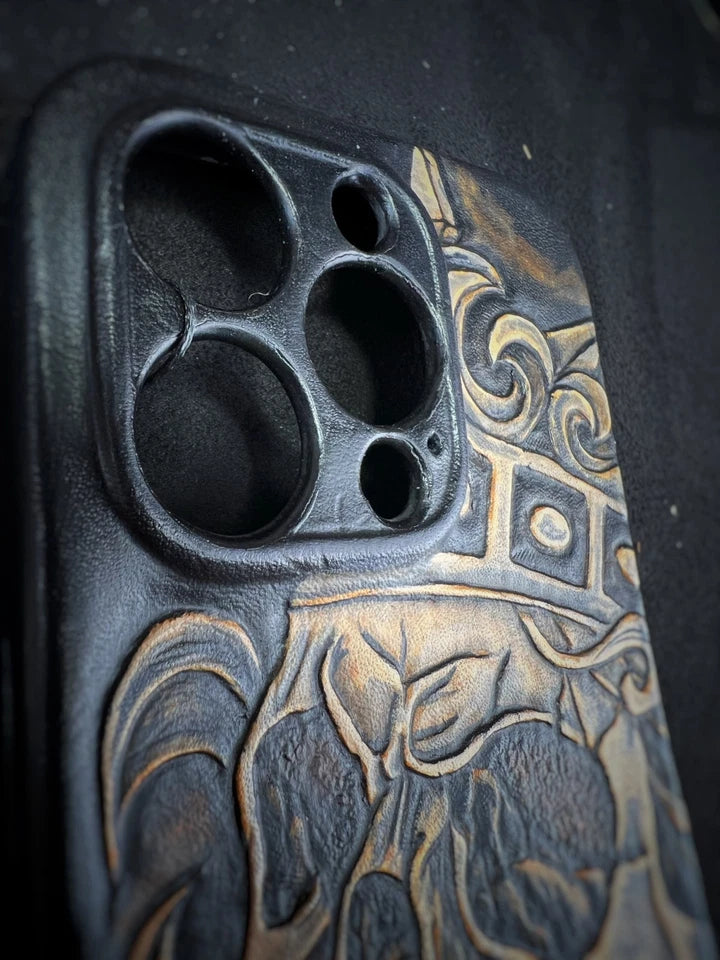 Hand-Carved Leather iPhone 14 Pro Case: Embossed Skull Art